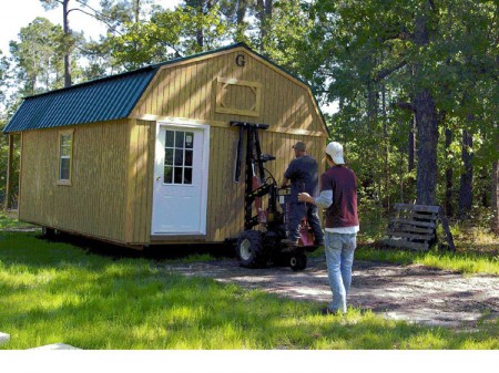 The delivery guys use something called a "mule" to wheel the portable building into place.
