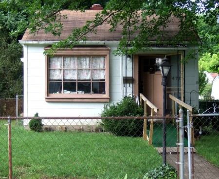 Large window with an inviting entry way.