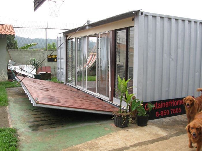 shipping container with a giant unfolding door. The size of the 