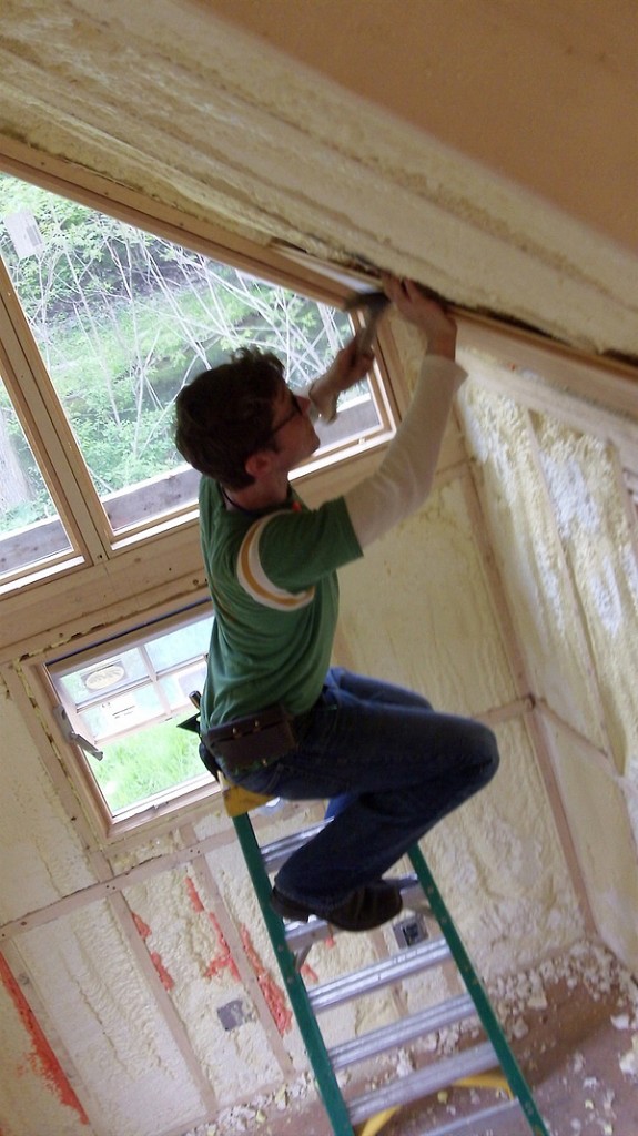 Nic putting up the first interior siding