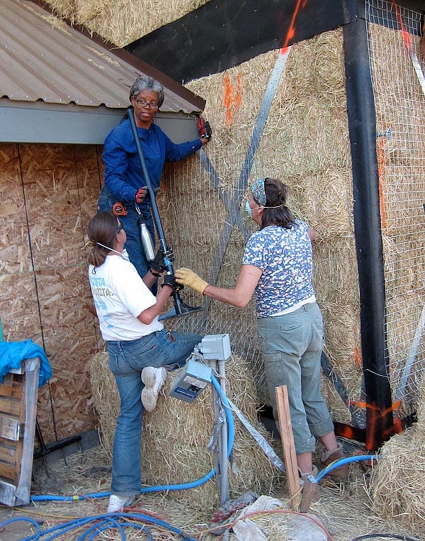 ladies installing the mesh