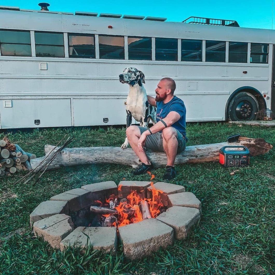 Bus, fire pit and dog