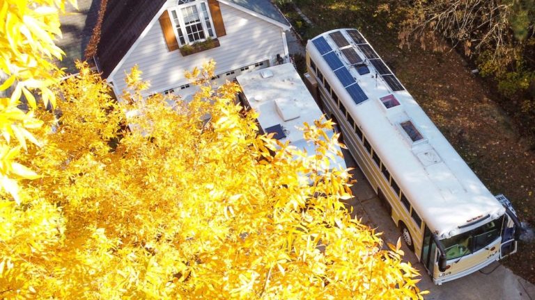 Skoolie in front of house