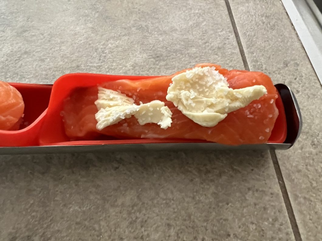 prepping salmon with butter and sea salt