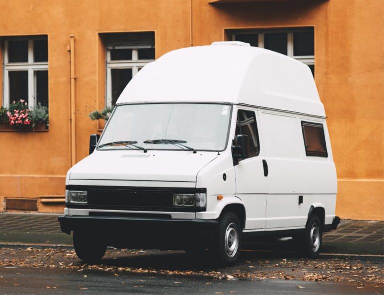 Van parked near a home